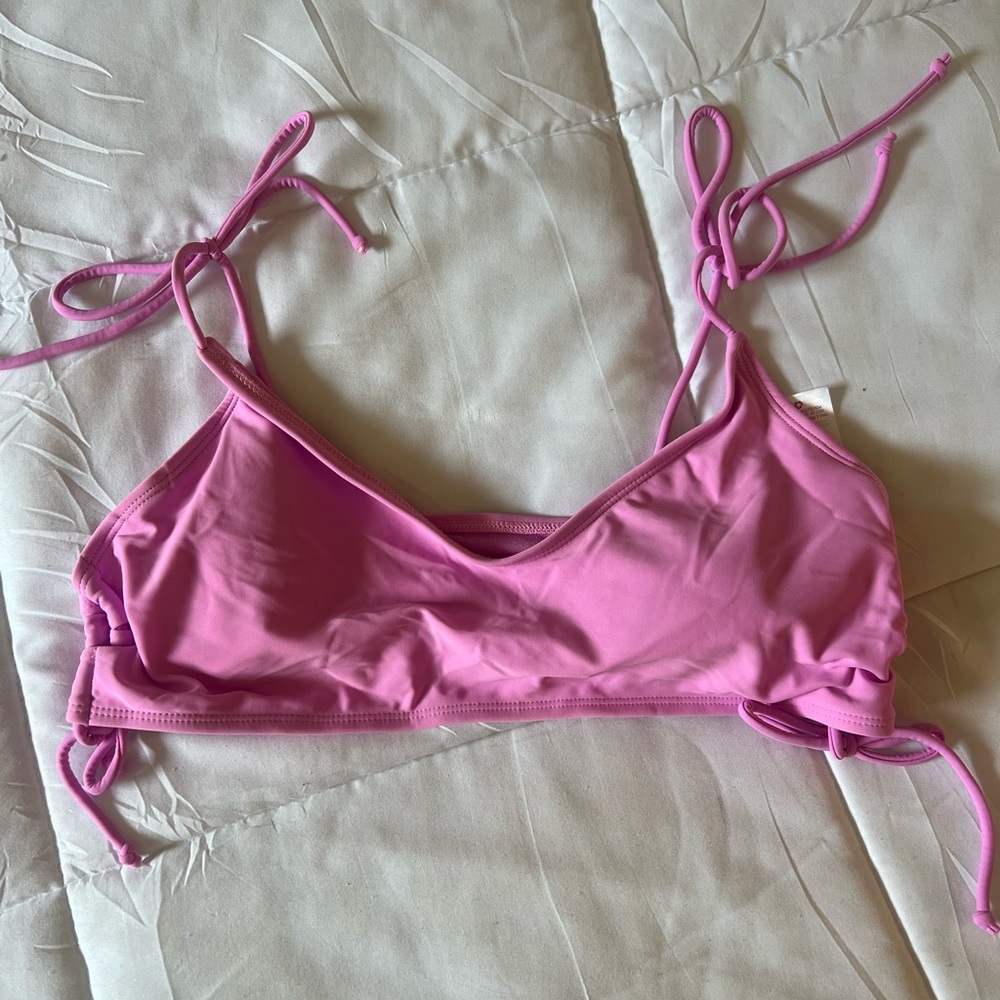 Magenta triangle bikini top, tie straps and adjustable tie sides.